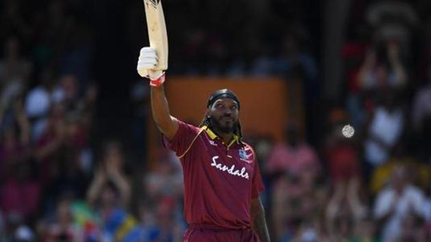 Chris Gayle of the West Indies celebrates reaching his century during the 1st One Day International match between the West Indies and England at Kensington Oval on February 20, 2019 in Bridgetown, Barbados. (Photo by Gareth Copley/Getty Images)(Getty Images)