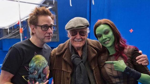 James Gunn poses with the late Stan Lee and Zoe Saldana.