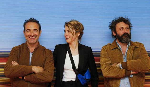 Director Quentin Dupieux and cast members Jean Dujardin and Adele Haenel pose during a photocall before the screening of the film Le Daim (Deerskin).(REUTERS)