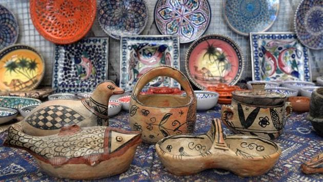 Pottery crafted in Sejnane is displayed at a souvenir shop. Sejnane has plans to build a museum and training centre to preserve its local know-how. The pottery, mostly cream-coloured with black and red motifs, was added in 2018 to the prestigious “Representative List of the Intangible Cultural Heritage of Humanity” of UNESCO, the United Nations cultural organisation. (Fethi Belaid / AFP) 