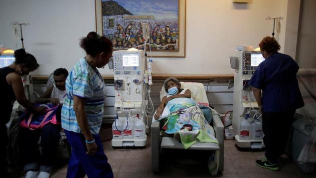 Lesbia Avila de Molina, 53, a kidney disease patient seen during a dialysis session at a dialysis centre, after a blackout. Dialysis requires consistent supplies of power and water to provide the recommended treatment of three or four hours, three times a week. Like any chronic kidney patient, he could die if he goes too long without treatment. (Ueslei Marcelino / REUTERS)