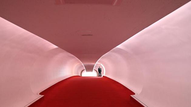 A security guard stands in the Hughes Wing after the ribbon cutting ceremony to officially open the TWA Hotel at John F. Kennedy International Airport in New York. (Timothy A. Clary / AFP) A security guard stands in the Hughes Wing after the ribbon cutting ceremony to officially open the TWA Hotel at John F. Kennedy International Airport in New York. (Timothy A. Clary / AFP)