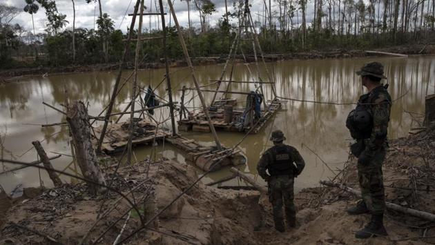 Fueled by rising global prices for gold, illegal mining destroyed 92,000 square miles (238,000 square kilometers) of forest between 2000 and 2015, according to the Amazonian Network of GeoReferenced Socio-Environmental Information. The use of hundreds of tons of toxic mercury in illegal mining across the continent has raised concerns about health problems on affected land, some of which is occupied by indigenous people. (Rodrigo Abd / AP) Fueled by rising global prices for gold, illegal mining destroyed 92,000 square miles (238,000 square kilometers) of forest between 2000 and 2015, according to the Amazonian Network of GeoReferenced Socio-Environmental Information. The use of hundreds of tons of toxic mercury in illegal mining across the continent has raised concerns about health problems on affected land, some of which is occupied by indigenous people. (Rodrigo Abd / AP)