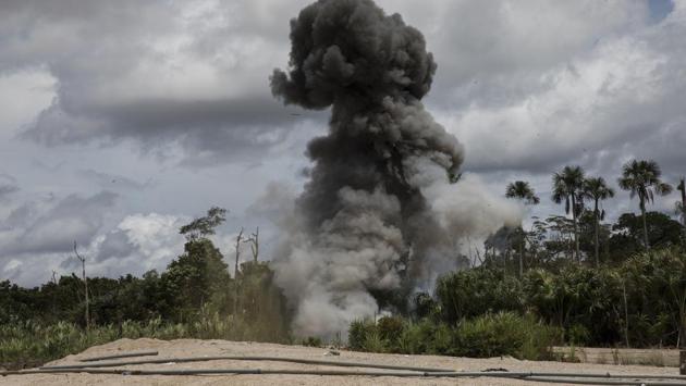The police and soldiers occasionally find machinery used by the illegal miners, and blow it up with dynamite. They also destroy metal tubing used to mine gold. Ernesto Ráez, a biology professor in the Peruvian capital of Lima, said it would take generations to restore and reforest areas affected by mining. “It will take more than a lifetime to see a forest comparable to the one that was destroyed,” he said. “But it’s worth it.” (Rodrigo Abd / AP) The police and soldiers occasionally find machinery used by the illegal miners, and blow it up with dynamite. They also destroy metal tubing used to mine gold. Ernesto Ráez, a biology professor in the Peruvian capital of Lima, said it would take generations to restore and reforest areas affected by mining. “It will take more than a lifetime to see a forest comparable to the one that was destroyed,” he said. “But it’s worth it.” (Rodrigo Abd / AP)