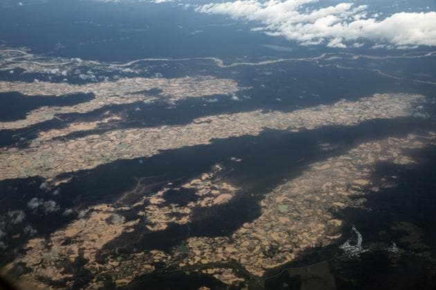 An aerial view of thousands of destroyed hectares of Amazon jungle by illegal miners. For a decade, a gold rush accelerated in Peru’s Tambopata province, a center for an illicit activity that is among the most lucrative, and destructive, in the Amazonian wilderness. Security forces came and went; miners scattered and returned. Then Peru announced to install long-term military bases in hopes of curbing not just illegal mining but also human trafficking and other associated crimes. (Rodrigo Abd / AP) An aerial view of thousands of destroyed hectares of Amazon jungle by illegal miners. For a decade, a gold rush accelerated in Peru’s Tambopata province, a center for an illicit activity that is among the most lucrative, and destructive, in the Amazonian wilderness. Security forces came and went; miners scattered and returned. Then Peru announced to install long-term military bases in hopes of curbing not just illegal mining but also human trafficking and other associated crimes. (Rodrigo Abd / AP)