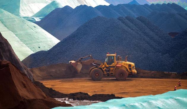 An excavator transfers imported iron ore at a port in Rizhao in China's eastern Shandong province. (AFP) An excavator transfers imported iron ore at a port in Rizhao in China's eastern Shandong province. (AFP)