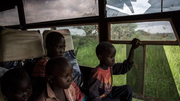 Young South Sudanese refugees are transported from the border of South Sudan and the Democratic Republic of the Congo to a refugee settlement site in Aru. (John Wessels / AFP) Young South Sudanese refugees are transported from the border of South Sudan and the Democratic Republic of the Congo to a refugee settlement site in Aru. (John Wessels / AFP)