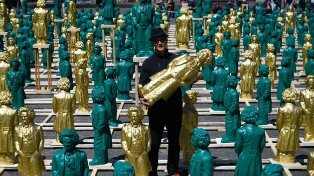 German conceptual artist Ottmar Hoerl poses next to some of his sculptures representing German composer Ludwig van Beethoven at the Muensterplatz square in Bonn, western Germany. (Ina Fassbender / AFP) German conceptual artist Ottmar Hoerl poses next to some of his sculptures representing German composer Ludwig van Beethoven at the Muensterplatz square in Bonn, western Germany. (Ina Fassbender / AFP)