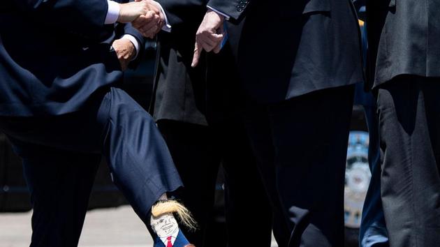 Louisiana Lt. Governor Billy Nungesser shows US President Donald Trump his socks after the President arrives at Chennault International Airport, in Lake Charles, Louisiana. (Brendan Smialowski / AFP) Louisiana Lt. Governor Billy Nungesser shows US President Donald Trump his socks after the President arrives at Chennault International Airport, in Lake Charles, Louisiana. (Brendan Smialowski / AFP)