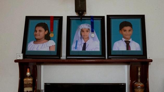 Photos of Rashini, 13, her sister Shalomi, 10, and brother Shalom, seven, who were killed during Easter Sunday bombings, are seen inside their house. Pradeep Thusantha who lost his wife and children was outside the church. “Me and my wife were deeply in love for the last 15 years. I worked hard to keep my family happy. Now I just have to leave this country and work for God for the rest of my life.” (Danish Siddiqui / REUTERS) Photos of Rashini, 13, her sister Shalomi, 10, and brother Shalom, seven, who were killed during Easter Sunday bombings, are seen inside their house. Pradeep Thusantha who lost his wife and children was outside the church. “Me and my wife were deeply in love for the last 15 years. I worked hard to keep my family happy. Now I just have to leave this country and work for God for the rest of my life.” (Danish Siddiqui / REUTERS)
