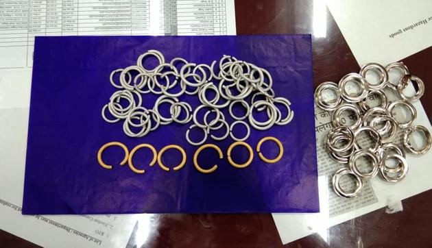The woman allegedly got the gold rings polished with rhodium (above) and then fixed them into her handbag (right). (Sourced) The woman allegedly got the gold rings polished with rhodium (above) and then fixed them into her handbag (right). (Sourced)