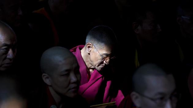 A Tibetan Buddhist monk prays during a ceremony for the longevity of their spiritual leader Dalai Lama in Dharamsala, Himachal Pradesh. (Ashwini Bhatia / AP) A Tibetan Buddhist monk prays during a ceremony for the longevity of their spiritual leader Dalai Lama in Dharamsala, Himachal Pradesh. (Ashwini Bhatia / AP)
