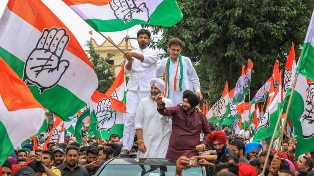 Punjab ministers and Congress leaders Navjot Singh Sidhu and Manpreet Singh Badal in an election campaign roadshow. (PTI photo) Punjab ministers and Congress leaders Navjot Singh Sidhu and Manpreet Singh Badal in an election campaign roadshow. (PTI photo)