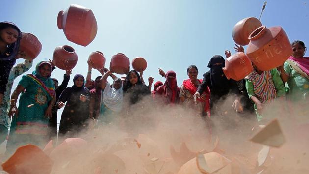 Women throw earthen pitchers onto the ground in protest against shortage of drinking water outside the municipal corporation office in Ahmedabad, Gujarat. (Amit Dave / REUTERS) Women throw earthen pitchers onto the ground in protest against shortage of drinking water outside the municipal corporation office in Ahmedabad, Gujarat. (Amit Dave / REUTERS)