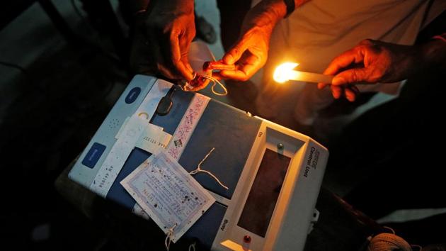 Polling officials seal an Electronic Voting Machine(EVM)at a polling station during the last phase of the general election in Kolkata. (Rupak De Chowdhuri / REUTERS) Polling officials seal an Electronic Voting Machine(EVM)at a polling station during the last phase of the general election in Kolkata. (Rupak De Chowdhuri / REUTERS)