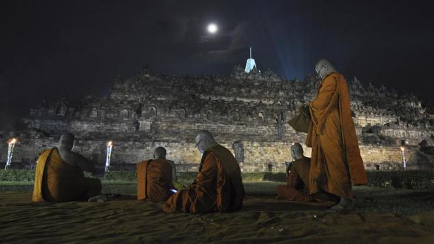 Monks pray during the commemoration of Vesak Day which marks the birth, death and enlightenment of Buddha at the Borobudur Temple. (Slamet Riyadi / AP) Monks pray during the commemoration of Vesak Day which marks the birth, death and enlightenment of Buddha at the Borobudur Temple. (Slamet Riyadi / AP)