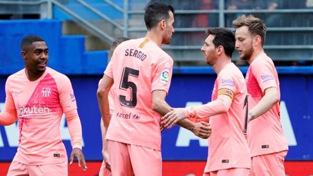 Barcelona's Lionel Messi celebrates scoring their second goal with team mates.(REUTERS)