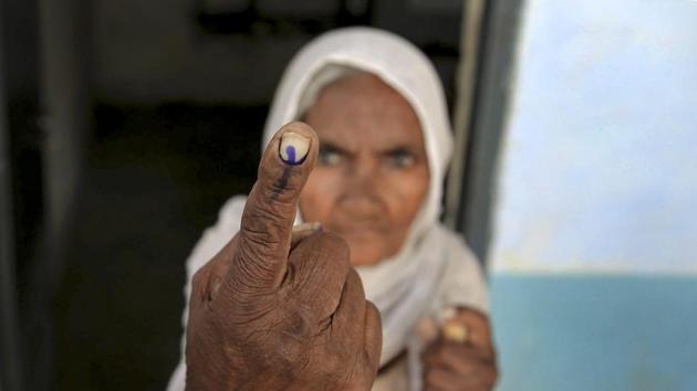 An elderly voter shows her finger marked with indelible ink at a polling station at village Bhoot, near Amritsar, Punjab. The Lok Sabha election is being seen as a mid-term test of popularity for CM Amarinder Singh-led Congress government which swept to power with a two-thirds majority in the 2017 assembly polls after ten years, is facing the SAD-BJP combine, Aam Aadmi Party (AAP) and the Punjab Democratic Alliance, a coalition of small parties. (PTI) An elderly voter shows her finger marked with indelible ink at a polling station at village Bhoot, near Amritsar, Punjab. The Lok Sabha election is being seen as a mid-term test of popularity for CM Amarinder Singh-led Congress government which swept to power with a two-thirds majority in the 2017 assembly polls after ten years, is facing the SAD-BJP combine, Aam Aadmi Party (AAP) and the Punjab Democratic Alliance, a coalition of small parties. (PTI)