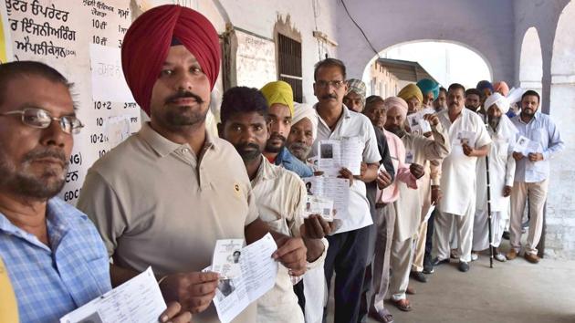 Ludhiana, India – May 19, 2019 : Voters standing in a queue to cast their votes at a polling booth at village Lalton in Ludhiana on Sunday, May 19, 2019. (Photo by Gurminder Singh/Hindustan Times)