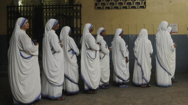 Nuns stand in a queue to cast their votes at St. Mary's School, Ripon Street, in Kolkata, West Bengal. Several heavyweights, including chief minister Mamata Banerjee’s nephew Abhishek Banerjee, TMC’s leader Sudip Bandyopadhyay and BJP national secretary Rahul Sinha are in the fray, along with TMC’s political greenhorns, actor-turned politicians Mimi Chakraborty and Nusrat Jahan. (Samir Jana / HT Photo) Nuns stand in a queue to cast their votes at St. Mary's School, Ripon Street, in Kolkata, West Bengal. Several heavyweights, including chief minister Mamata Banerjee’s nephew Abhishek Banerjee, TMC’s leader Sudip Bandyopadhyay and BJP national secretary Rahul Sinha are in the fray, along with TMC’s political greenhorns, actor-turned politicians Mimi Chakraborty and Nusrat Jahan. (Samir Jana / HT Photo)