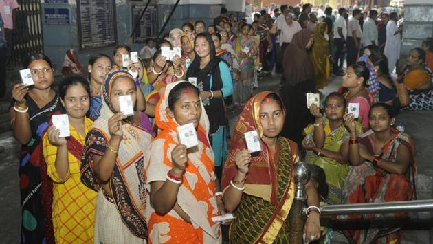 Women show their voter IDs before casting their vote during the seventh and final phase of Lok Sabha elections, at KMC office, Esplanade, in Kolkata, West Bengal. Eight of the nine seats have been with the TMC since 2009. (Samir Jana / HT Photo) Women show their voter IDs before casting their vote during the seventh and final phase of Lok Sabha elections, at KMC office, Esplanade, in Kolkata, West Bengal. Eight of the nine seats have been with the TMC since 2009. (Samir Jana / HT Photo)