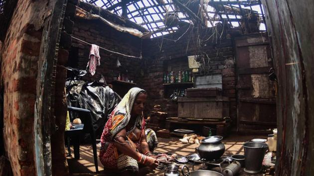 A woman cooks inside her house destroyed by the cyclone ‘Fani’ in the Pratap Purushottampur village area of Puri in the eastern Indian state of Odisha on May 10, 2019.(AFP file photo for representation)