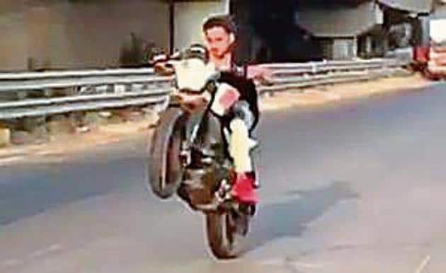 A video grab of Adnan Shaikh performing bike stunts.(HT)