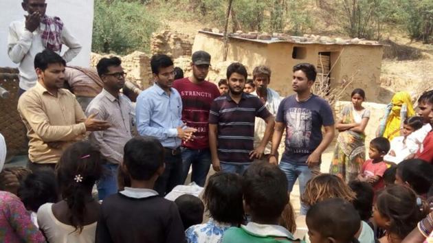 Medical student Ashwani Parashar with friends from SMS Medical College at Rajghat village in Dholpur.(HT Photo)