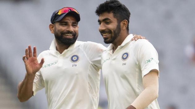India's Mohammed Shami, left, speaks with Jasprit Bumrah during play on day four of the third Test against Australia.(AP)