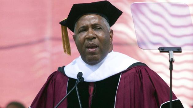 Billionaire technology investor and philanthropist Robert F Smith announces he will provide grants to wipe out the student debt of the entire 2019 graduating class at Morehouse College in Atlanta, Sunday, May 19, 2019.(AP Photo) Billionaire technology investor and philanthropist Robert F Smith announces he will provide grants to wipe out the student debt of the entire 2019 graduating class at Morehouse College in Atlanta, Sunday, May 19, 2019.(AP Photo)