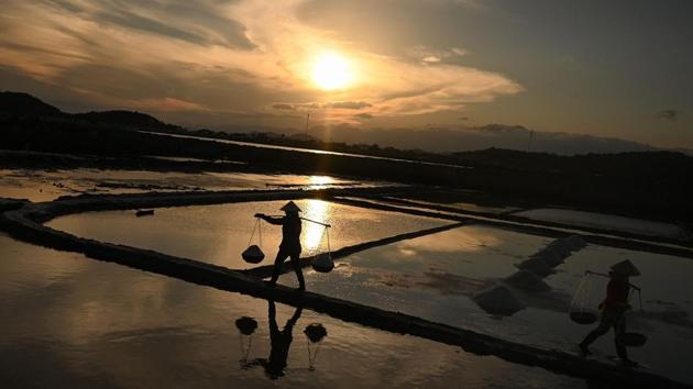 However, only a few farmers have felt the impact of the plan -- or ever heard about it -- in Hon Khoi, where the salt industry remains the main employer. Consequently, many farmers are just taking a gamble on the sector. (Manan Vatsyayana / AFP) However, only a few farmers have felt the impact of the plan -- or ever heard about it -- in Hon Khoi, where the salt industry remains the main employer. Consequently, many farmers are just taking a gamble on the sector. (Manan Vatsyayana / AFP)
