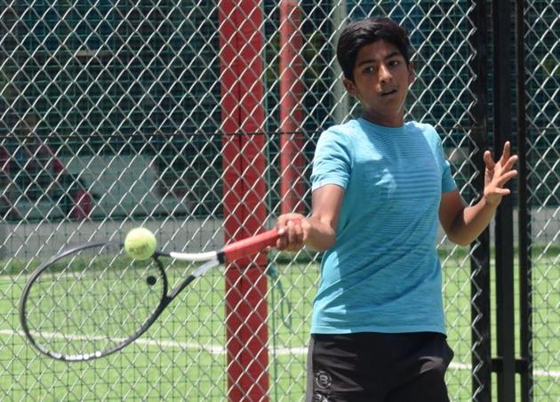 Eshan Degamwar plays against Nachiket Gore (not in pic) during the second round of PMDTA-KPIT Junior Champions Bronze series tennis at Metrocity Sports & Health Club, Kothrud on Monday. (HT PHOTO) Eshan Degamwar plays against Nachiket Gore (not in pic) during the second round of PMDTA-KPIT Junior Champions Bronze series tennis at Metrocity Sports & Health Club, Kothrud on Monday. (HT PHOTO)