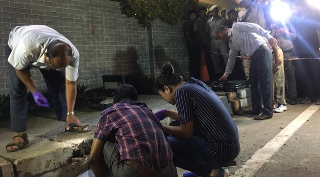 Forensic personnel at the scene of the grenade attack outside a mall in Guwahati on May 15.(HT PHOTO) Forensic personnel at the scene of the grenade attack outside a mall in Guwahati on May 15.(HT PHOTO)