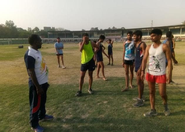 Gulab Chand(left) during a training session with young atheletes in Lucknow.(HT Photo)