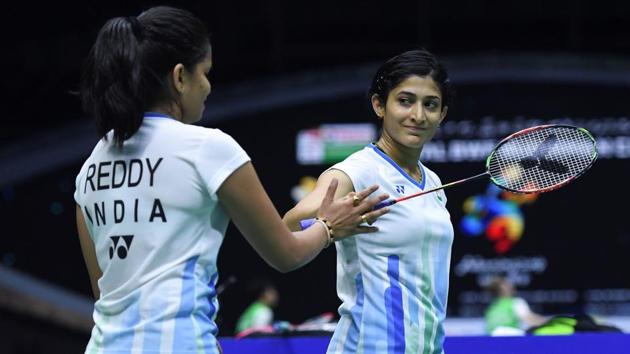 Ashwini Ponnappa (R) and N.Sikki Reddy react after winning a point against Chow Mei Kuan and Lee Meng Yean.(AFP)