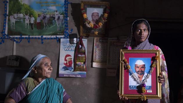 Gangubai Bhanuse (L) looks on as Rekha Bhanuse poses with a picture of her husband Sanjay Bhanuse who died in crocodile attack in Tung village, Sangli. “Locals have been asked to avoid entering the river, if they spot a crocodile with three kilometers of the site. The death of the 12-year-old boy is a grim reminder of the conflict. As the crocodile mating season is on, we need to be extra careful,” said Abhijeet Chaudhari, collector and district magistrate, Sangli. (Anshuman Poyrekar / HT Photo) Gangubai Bhanuse (L) looks on as Rekha Bhanuse poses with a picture of her husband Sanjay Bhanuse who died in crocodile attack in Tung village, Sangli. “Locals have been asked to avoid entering the river, if they spot a crocodile with three kilometers of the site. The death of the 12-year-old boy is a grim reminder of the conflict. As the crocodile mating season is on, we need to be extra careful,” said Abhijeet Chaudhari, collector and district magistrate, Sangli. (Anshuman Poyrekar / HT Photo)