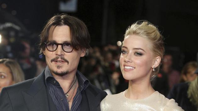 Johnny Depp, left, and Amber Heard arrive for the European premiere of their film, The Rum Diary.(AP)