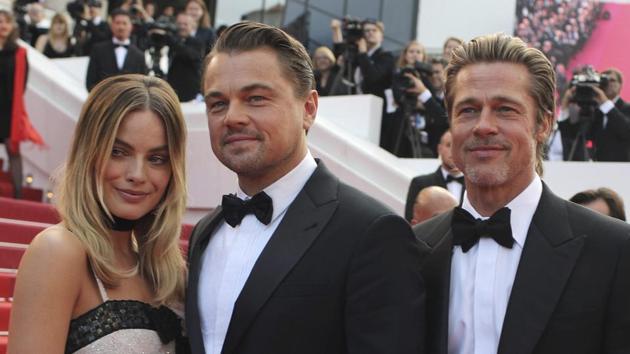 Actors Margot Robbie from left, Leonardo DiCaprio and Brad Pitt poses for photographers upon arrival at the premiere of the film Once Upon a Time in Hollywood at the 72nd international film festival, Cannes.(AP)