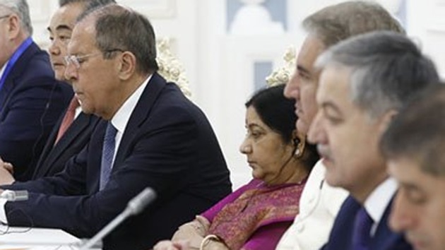 According to the photos published by the Pakistani media, Swaraj and Qureshi were seen seated next to each other along with other foreign ministers. (Photo Credit Geo News) According to the photos published by the Pakistani media, Swaraj and Qureshi were seen seated next to each other along with other foreign ministers. (Photo Credit Geo News)