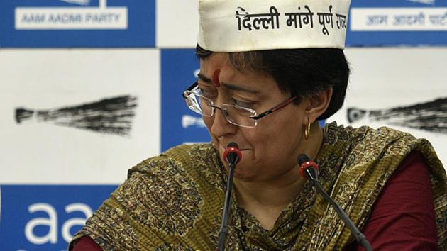 During the run-up to the sixth phase of the polls in Delhi, Aam Aadmi Party (AAP) East Delhi candidate Atishi Marlena broke down while reading a derogatory pamphlet allegedly distributed by the Bharatiya Janata Party’s (BJP) candidate Gautam Gambhir against her, during a press conference at the AAP party office in New Delhi. (Biplov Bhuyan / HT Photo) 