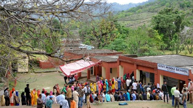 During the second phase of the polls on May 18, people queued to cast their votes at a government school at Udhampur, about 75 km from Jammu. Jammu and Kashmir contributes to 6 seats in the 543-membered Lok Sabha but saw polling the process of re-polling drag across several phases due to either security concerns or low voter participation. (Nitin Kanotra / HT Photo) 