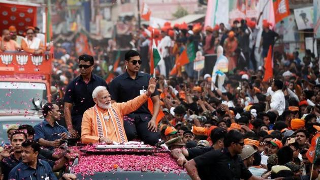 Prime Minister Narendra Modi waves towards his supporters during a roadshow in Varanasi, on April 25, 2019. (REUTERS)