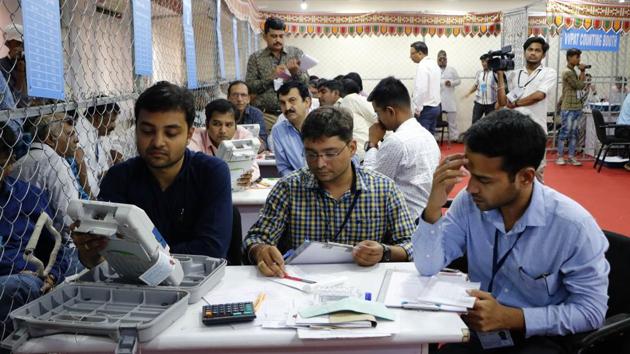 Election Official at a counting centre in Ahmedabad. The BJP is leading in four of the 26 Lok Sabha seats in Gujarat, including Gandhinagar where party president Amit Shah is contesting, while the Congress is ahead in one seat, as per initial trends. (Siddharaj Solanki / HT Photo) Election Official at a counting centre in Ahmedabad. The BJP is leading in four of the 26 Lok Sabha seats in Gujarat, including Gandhinagar where party president Amit Shah is contesting, while the Congress is ahead in one seat, as per initial trends. (Siddharaj Solanki / HT Photo)