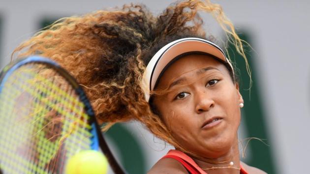 Japan's Naomi Osaka returns the ball to Madison Keys of the US during their women's singles third round match.(AFP)