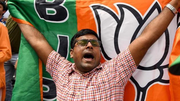 As part of the celebration, the supporters at central BJP headquarters were carrying party flags and wishing each other.(AFP File Photo)