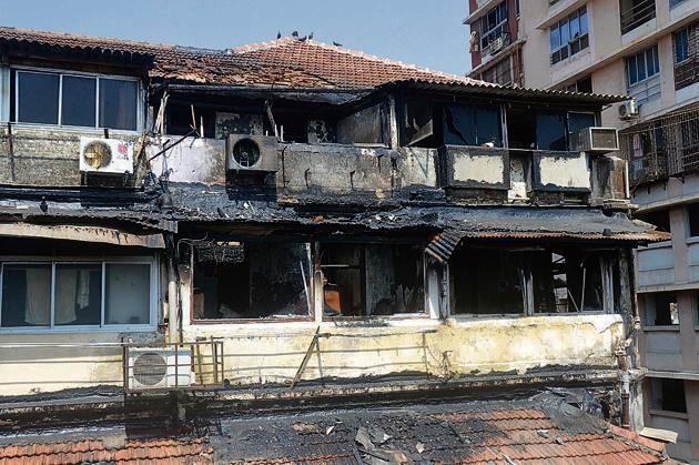 The fire engulfed the top two floors of the building and was doused after five hours.(HT photo) The fire engulfed the top two floors of the building and was doused after five hours.(HT photo)