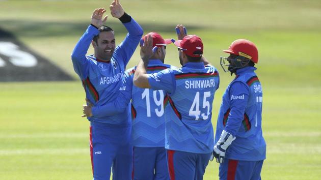 Afghanistan's Mohammad Nabi, left, celebrates after taking the wicket of Pakistan's Haris Sohail. (AP) Afghanistan's Mohammad Nabi, left, celebrates after taking the wicket of Pakistan's Haris Sohail. (AP)