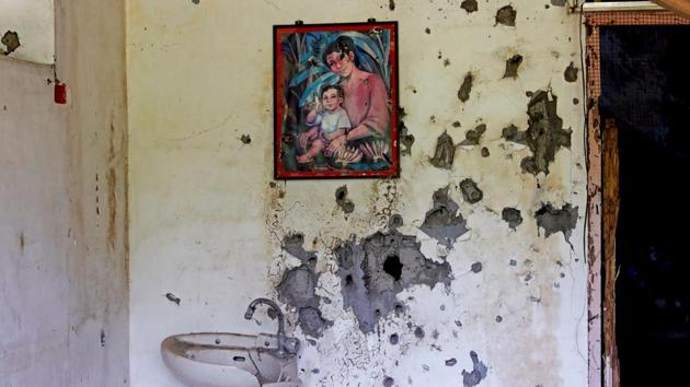A painting of a mother and a child hangs on a wall at a bullet-riddled structure in the city. Marawi was once one of the most picturesque cities in the Philippines. About half of it is now charred concrete and skeletons of buildings, the effects of 154 days of air strikes and artillery by the military, and booby traps the rebels laid everywhere to keep them at bay. (Eloisa Lopez / REUTERS) A painting of a mother and a child hangs on a wall at a bullet-riddled structure in the city. Marawi was once one of the most picturesque cities in the Philippines. About half of it is now charred concrete and skeletons of buildings, the effects of 154 days of air strikes and artillery by the military, and booby traps the rebels laid everywhere to keep them at bay. (Eloisa Lopez / REUTERS)