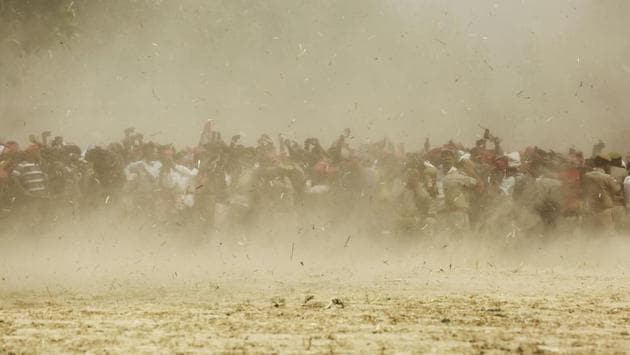 Supporters of SP president Akhilesh Yadav seen through dust as a helicopter lands at a rally venue in Uttar Pradesh. Once the dust did settle on May 23 and election counting began, it appeared clear that the BJP juggernaut hadn’t yet lost steam and instead gained momentum in the post-Balakot environment, returning with 303 seats and bettering 2014’s 282. (Rajesh Kumar Singh / AP) Supporters of SP president Akhilesh Yadav seen through dust as a helicopter lands at a rally venue in Uttar Pradesh. Once the dust did settle on May 23 and election counting began, it appeared clear that the BJP juggernaut hadn’t yet lost steam and instead gained momentum in the post-Balakot environment, returning with 303 seats and bettering 2014’s 282. (Rajesh Kumar Singh / AP)