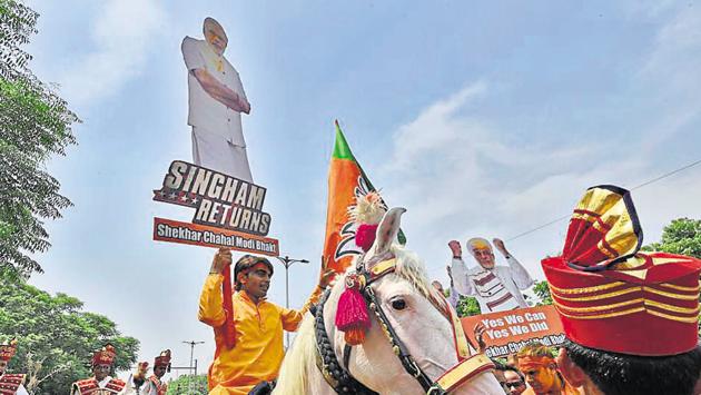 Bharatiya Janta Party (BJP) supporters celebrate the party's victory in the Lok Sabha Elections, at party headquarters, in New Delhi, India, on Thursday.(Burhaan Kinu/HT PHOTO)